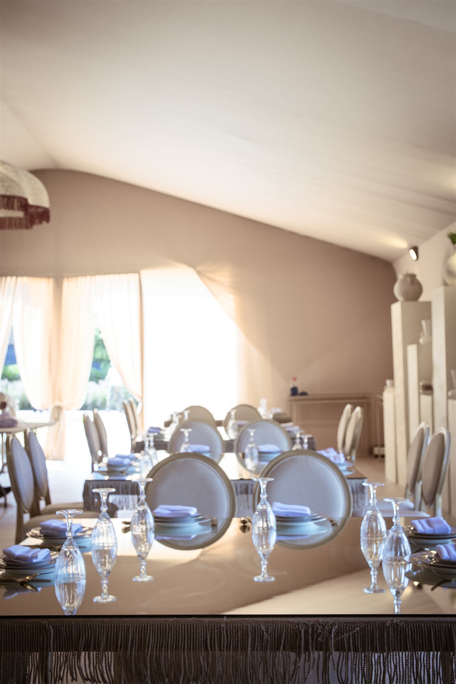 Room dressed in white sheer drapes
